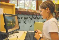  ??  ?? A Macdonough student researches Middletown history as part of a STEM class assignment.