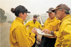  ?? Carlos Avila Gonzalez / The Chronicle ?? Beverly Gardiner (Australia), Thomas Harre (New Zealand) and Justin Pinson (Australia) with Peter Tolosano of California Interagenc­y Incident Management.