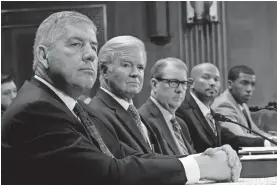  ?? PHOTO/SUSAN WALSH, FILE] ?? Big 12 Commission­er Bob Bowlsby, left, sits next to NCAA President Mark Emmert during a U.S. Senate subcommitt­ee hearing in February. [AP