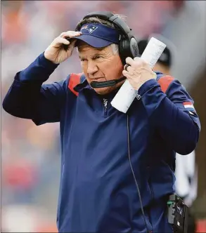  ?? Michael Dwyer / Associated Press ?? Patriots head coach Bill Belichick looks on during the first half against the Dolphins.