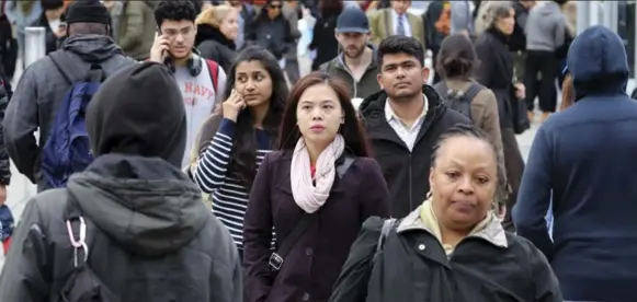  ?? RICHARD LAUTENS/TORONTO STAR ?? CHANGING FACE OF A CITY Toronto’s Yonge-Dundas Square reflects the new reality of a culturally diverse country where an increasing number of people identify as a visible minority.