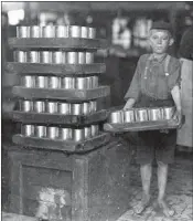  ??  ?? One of the small boys working in the JS Farrand Packing Co. is photograph­ed by Hine in Baltimore, Md. in 1911.