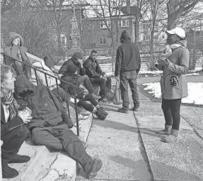 ?? PROVIDED BY LOVERN GORDON ?? Lovern Gordon, right, speaks to a group of homeless people near Boston. Gordon, a survivor of domestic abuse and founder of the Love Life Now Foundation, said reaching out to others is the best way to overcome trauma. She is skeptical, however, that communitie­s of color will have the resources needed in the wake of COVID-19.
