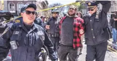  ?? PHOTO: BLOOMBERG ?? New York police detain a pro-palestinia­n demonstrat­or at Columbia University. As campus protests continued, the university moved its classes online