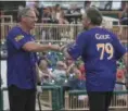  ?? ERIC BONZAR — THE MORNING JOURNAL ?? Former Browns defensive tackle Bob Golic gets a fist bump from former Indians left fielder Joe Charboneau.