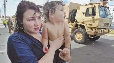  ?? STAFF PHOTOS BY PATRICK WHITTEMORE ?? COLD COMFORT: Lawrence residents Amber Cook, above holding her 2-year-old son Eli, and Jennifer Dejesus, right, both felt that Columbia Gas was not doing enough to help families.