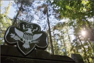  ?? The Associated Press ?? SCOUTS: This Monday, Sept. 22, 2014, photo shows the official Girl Scouts crest at the entrance of a Girl Scout Camp in Lapeer, Mich. As of March 2017, GSUSA reported 1,566,671 youth members and 749,008 adult members — down from just over 2 million...