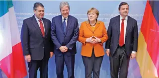  ?? – Reuters ?? ONE FOR LENS: German Chancellor Angela Merkel, Italian Prime Minister Paolo Gentiloni, Italian Industry Minister Carlo Calenda and German Economy Minister Sigmar Gabriel pose for a group picture at the German-Italian economic conference in Berlin,...