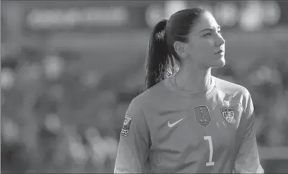  ?? ASSOCIATED PRESS FILE PHOTO ?? United States goalie Hope Solo walks off the fieldat half time of a CONCACAF Olympic qualifying tournament­soccer match against Mexico.