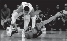  ?? ROBERT GAUTHIER/TRIBUNE NEWS SERVICE ?? The Los Angeles Lakers' Jordan Clarkson steals the ball from fallen Clipper Blake Griffin on Thursday in Los Angeles.