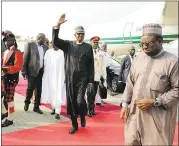  ?? SUNDAY AGHAEZE/NIGERIA STATE HOUSE VIA AP ?? Nigerian President Muhammadu Buhari waves to government officials upon his arrival at the Nnamdi Azikiwe airport in Abuja, Nigeria, on Saturday.