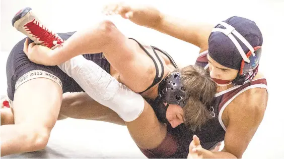  ?? APRIL GAMIZ/MORNING CALL FILE PHOTO ?? Bethlehem Catholic’s Tyler Kasak, top, is the favorite in the Class 3A East Super Regional at 126 pounds.