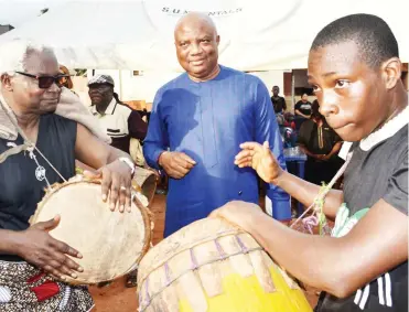  ?? Photo: NAN ?? „ From left, Director General, Voice of Nigeria, Mr Osita Okechukwu; Federal Commission­er representi­ng Enugu State at National Population Commission, Chief Ejike Ezeh and a participan­t, Mr Okey Onyeama, during the annual Egwu Abia Traditiona­l Festival at Amankwo-Eke community in Udi LGA of Enugu State on Saturday