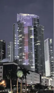  ?? DOUG BENC AP Images for World Satellite Television News ?? The Paramount Miami Worldcente­r tower is characteri­zed by its 13,400 programmab­le LED lights.