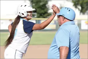  ?? RECORDER PHOTOS BY CHIEKO HARA ?? Above: Monache High School’s Alyssa Gonzales, left, celebrates with head coach Dave Koontz after hitting a triple Wednesday. Left: Monache High School’s Evette Mendoza takes a swing Wednesday, May 16, during an opening round game of the CIF Central...