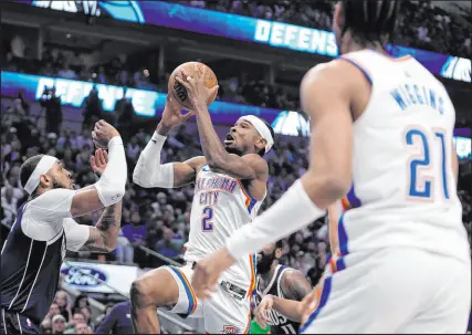  ?? Tony Gutierrez The Associated Press ?? Oklahoma City guard Shai Gilgeous-alexander drives the lane for two of his game-high 34, helping the Thunder even their second-round series with Dallas at two games apiece.