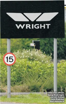  ?? PA ?? Unite union officials George Brash (right) and Colin Graham leave Wrightbus plant yesterday