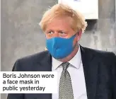  ??  ?? Boris Johnson wore a face mask in public yesterday