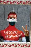  ?? AJIT SOLANKI/ASSOCIATED PRESS ?? Rajkumar Haryani, 38, who painted his body to create awareness about vaccinatio­n, poses for photos June 12 after getting a dose of Covishield vaccine in Ahmedabad, India.