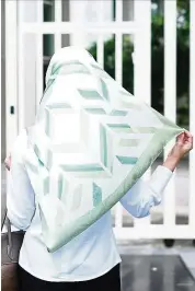  ??  ?? Duck Scarves debuts a collection with geometric designs celebratin­g local kuih.