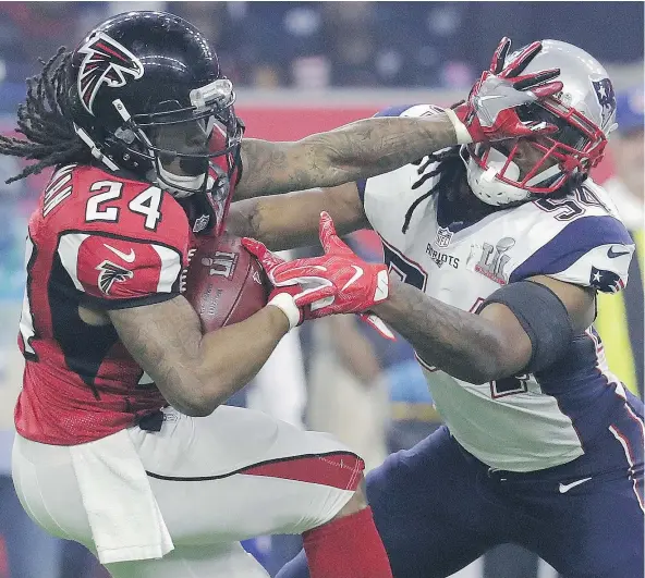  ?? — THE ASSOCIATED PRESS FILES ?? Devonta Freeman has been a 1,000-yard rusher for the Atlanta Falcons each of the last two seasons and produced a game-high 75 yards in the Super Bowl against the New England Patriots. His performanc­e has been rewarded with a lucrative deal.