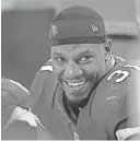  ?? GETTY IMAGES ?? Cardinals running back David Johnson smiles while sitting on the bench during a game against the Saints on Dec. 18.