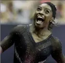  ?? Associated Press ?? Simone Biles celebrates after winning the all- around competitio­n.