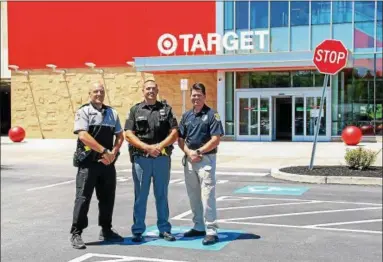  ?? SUBMITTED PHOTO ?? (From left) Officers Chris Dolga and Joseph Davies of Upper Merion Township Police Department and Officer Mark Lacy of Plymouth Township Police Department are organizing a National Night Out at Target in King of Prussia on Aug. 7. The free event is...