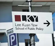  ?? AFP ?? Legacy of founding father A sign board pointing towards the Lee Kuan Yew School of Public Policy in Singapore.