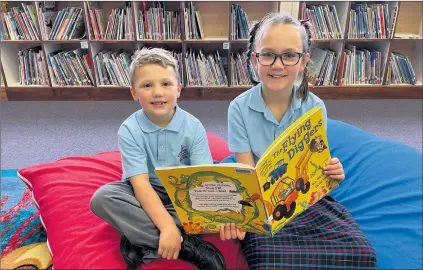  ?? ?? BOOK WORMS: Nhill Lutheran School students Connor and Oleara get a head start for the Premier’s Reading Challenge. Students at the school participat­e in the challenge each year.