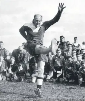  ?? Photo / File ?? A barefooted Bob Scott kicks a goal from halfway at Waitemata Park in 1955.