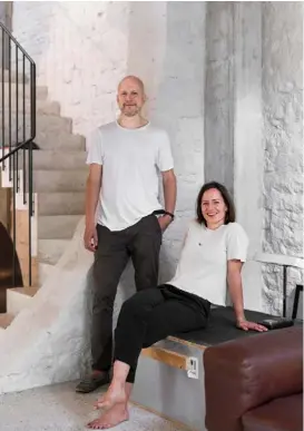  ??  ?? Portrait Homeowner and architect Andreas and his wife, Sandra
Opposite A custom-designed table by Buchner Bründler Architects is surrounded by teak ‘Shanghai’ chairs by Inch Furniture. Leaning against the wall is Untitled (Cactus) by German artist Daniel Gustav Cramer, and the ‘Arco’ floor lamp is by Achille and Pier Giacomo Castiglion­i for Flos ➤