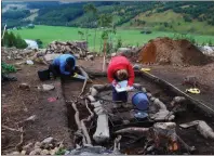  ??  ?? Archaeolog­ists at the site which dates back about 2,400 years.