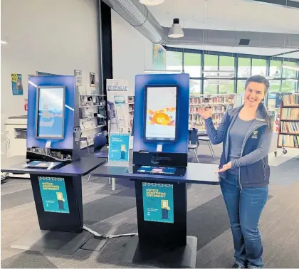  ?? Photo / Supplied ?? Te Awamutu library assistant Louise Waywith the newly installed digital kiosks.