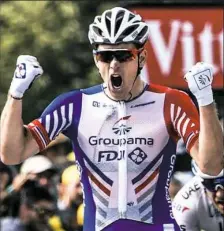  ?? Jeff Pachoud/AFP/Getty Images ?? France’s Arnaud Demare celebrates as he crosses the finish line to win the 18th stage of the Tour de France Thursday between Trie-sur-Baise and Pau in southweste­rn France.