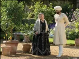  ?? PETER MOUNTAIN — FOCUS FEATURES VIA AP ?? In this image released by Focus Features, Judi Dench, left, and Ali Fazal appear in a scene from “Victoria and Abdul.”