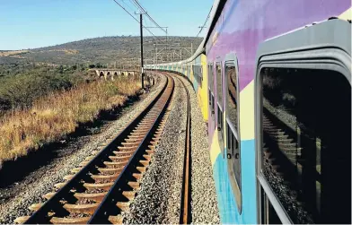  ?? Picture: Paul Ash ?? IN THE MEYL One of Shosholoza Meyl’s eight passenger trains seen crossing a bridge near Pietermari­tzburg.