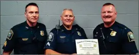  ??  ?? Cpl. Mason Brewer (center) was recently commended by LaFayette Police Department. From left: Sgt. Robbie Tate, Brewer, and Lt. Tom Kendrick.