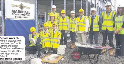  ??  ?? School work Cllr Miller is pictured with head teacher Connie Letford and pupils Chloe Scott and Murray Knox at the site of the new Alyth Primary School. Pic: David Phillips