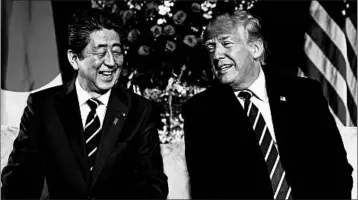  ?? PABLO MARTINEZ MONSIVAIS/AP ?? Japan’s Shinzo Abe and President Donald Trump share a light moment Tuesday, when North Korea was a central topic.