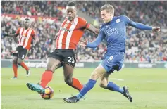  ??  ?? Leicester City’s Jamie Vardy in action with Sunderland’s Lamine Kone. — Reuters photo