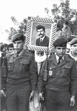  ?? (Micha Bar-Am/Magnum Photos, Inc.) ?? A DRUZE frontier force policeman (pictured in the photograph), killed in active service on the West Bank, is buried in his Western Galilee home village around 1980.