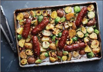 ?? ?? Ali Slagle’s sausages with Brussels sprouts and potatoes are sweetened with tangy honey mustard and add to the argument that sheet-pan dinners make the best weeknight meals.