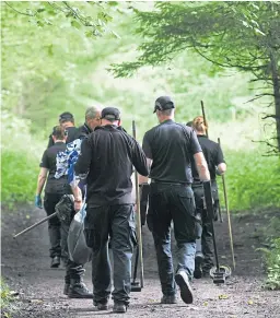  ??  ?? Top: Linda McDonald and husband Matthew leave the court with family and friends. Above: Police officers search for evidence in Templeton Woods after the attack.