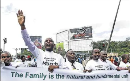  ?? Photos: Thomas Mukoya/Reuters and Trevor Snapp/AFP ?? Away to go: Conservati­ve Kenyan MP Irungu Kang’ata at an anti-gay march in Kenya (above) and a fervently anti-homosexual preacher in Uganda (below) illustrate the fertile ground conservati­ve US churches find in Africa, jeopardisi­ng the safety of queer...