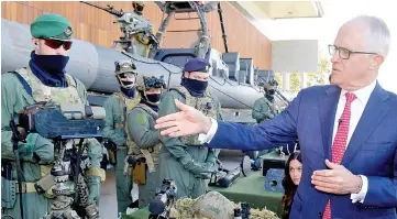  ??  ?? Turnbull talks with Special Operations Command soldiers during a visit to the Australian Army’s Holsworthy Barracks located in western Sydney. — Reuters photo