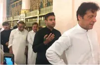  ?? — Photo courtesy Zulfi Bukhari/ Twitter ?? Zulfi Bukhari follows Imran Khan at Prophet’s Mosque in the holy city of Madinah.