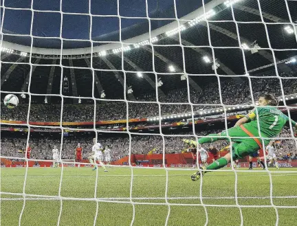  ?? DENNIS GROMBKOWSK­I/BONGARTS/GETTY IMAGES ?? Carli Lloyd of the U.S. scores the opening goal from a penalty kick in Women’s World Cup semifinal action against Germany at Olympic Stadium on Tuesday. Lloyd also set up the goal that iced a 2-0 victory for the Americans.