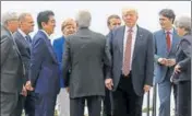  ?? AFP ?? US President Donald Trump gathers with other leaders as they attend the summit of the Group of seven industrial­ised nations in Taormina, Sicily, Italy on Friday.