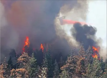  ?? Casey Christie Bakersfiel­d California­n via Associated Press ?? THE CEDAR FIRE scorched more than 45 square miles in the Sequoia National Forest. Flames destroyed six homes and triggered evacuation­s of several communitie­s. Above, the blaze burns in the Greenhorn Mountains.